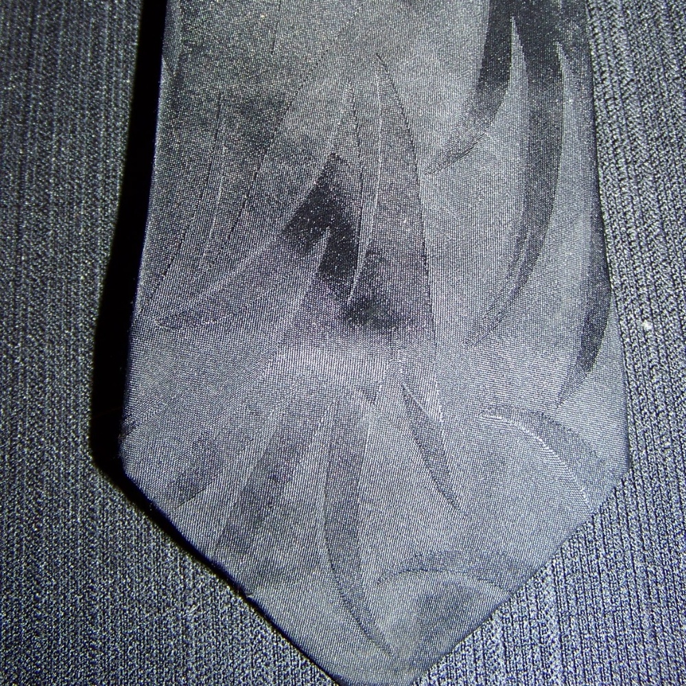 Black textured neck tie by the men’s store